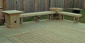 Get creative with your deck benches. Add built in planters and tables 