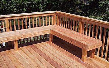 Deck bench in front of railing
