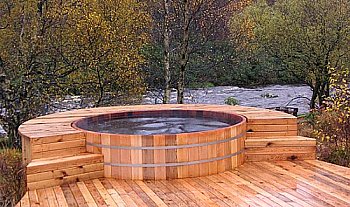 hot tub with wooden surround